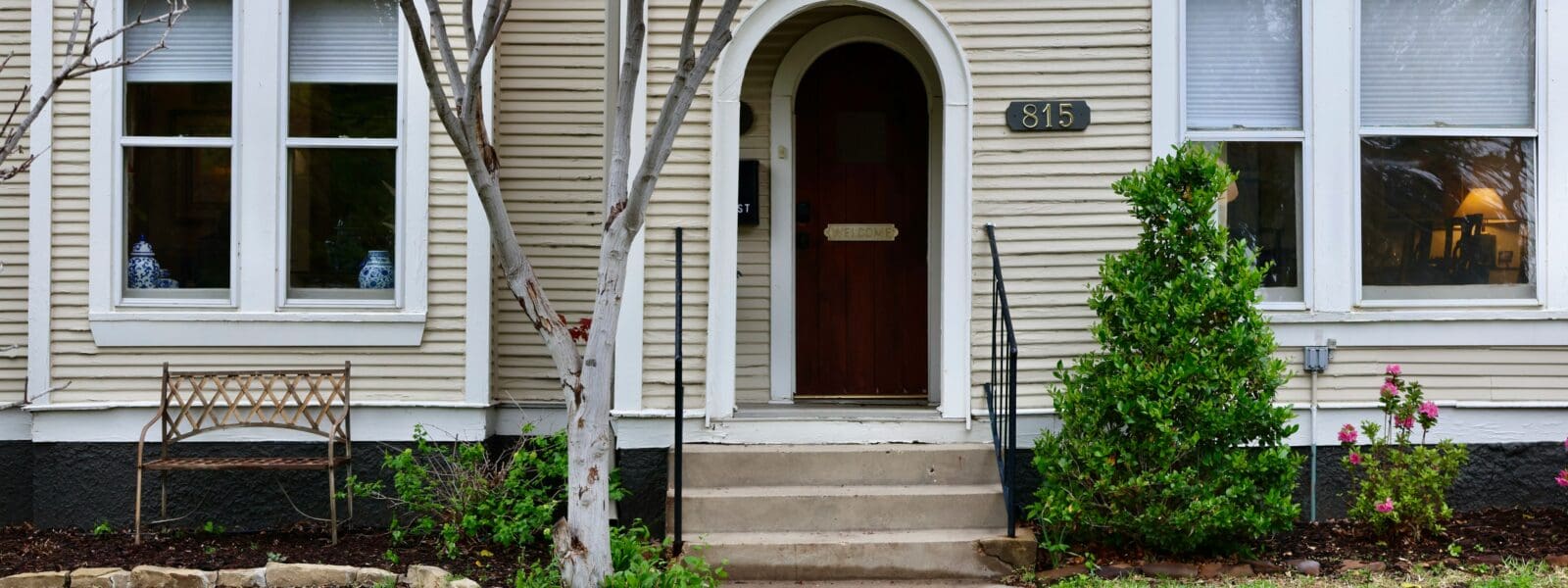 front of a house with tree out front