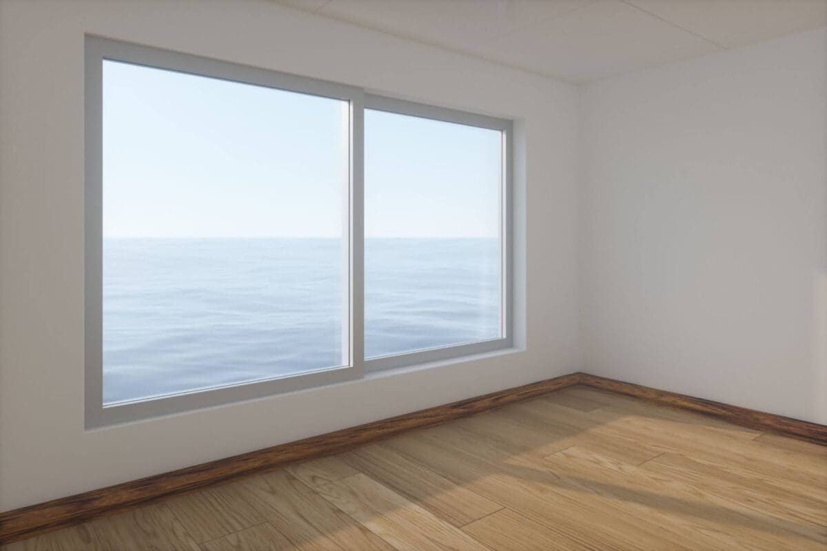 A window in an empty white-walled and hardwood floored room