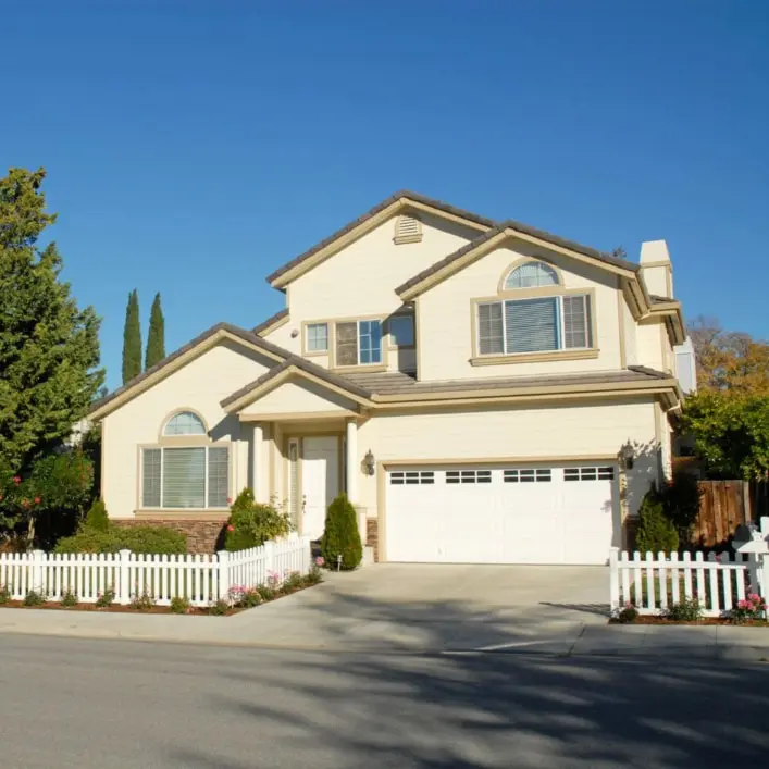 Two-Story Home With White Replacement Windows