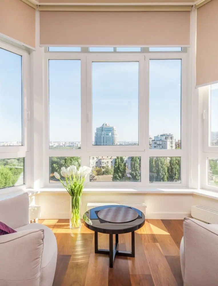 Bright Living Room With Large City View Windows