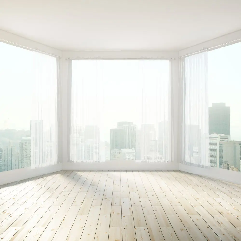 Large Corner Windows With City Skyline View