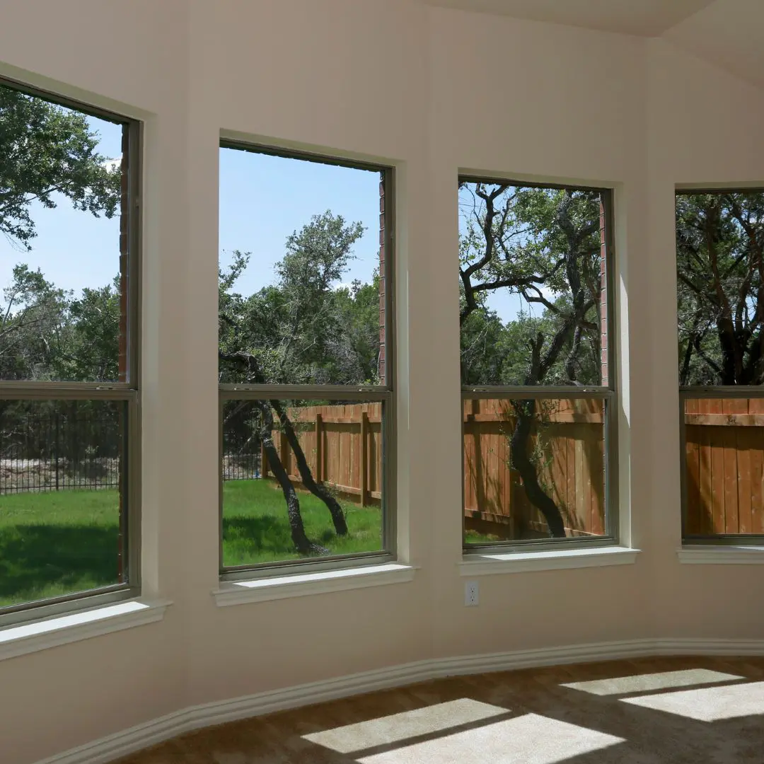 Multiple Living Room Windows With Backyard View