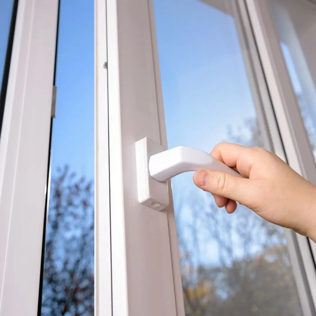 Person Opening White Window Handle