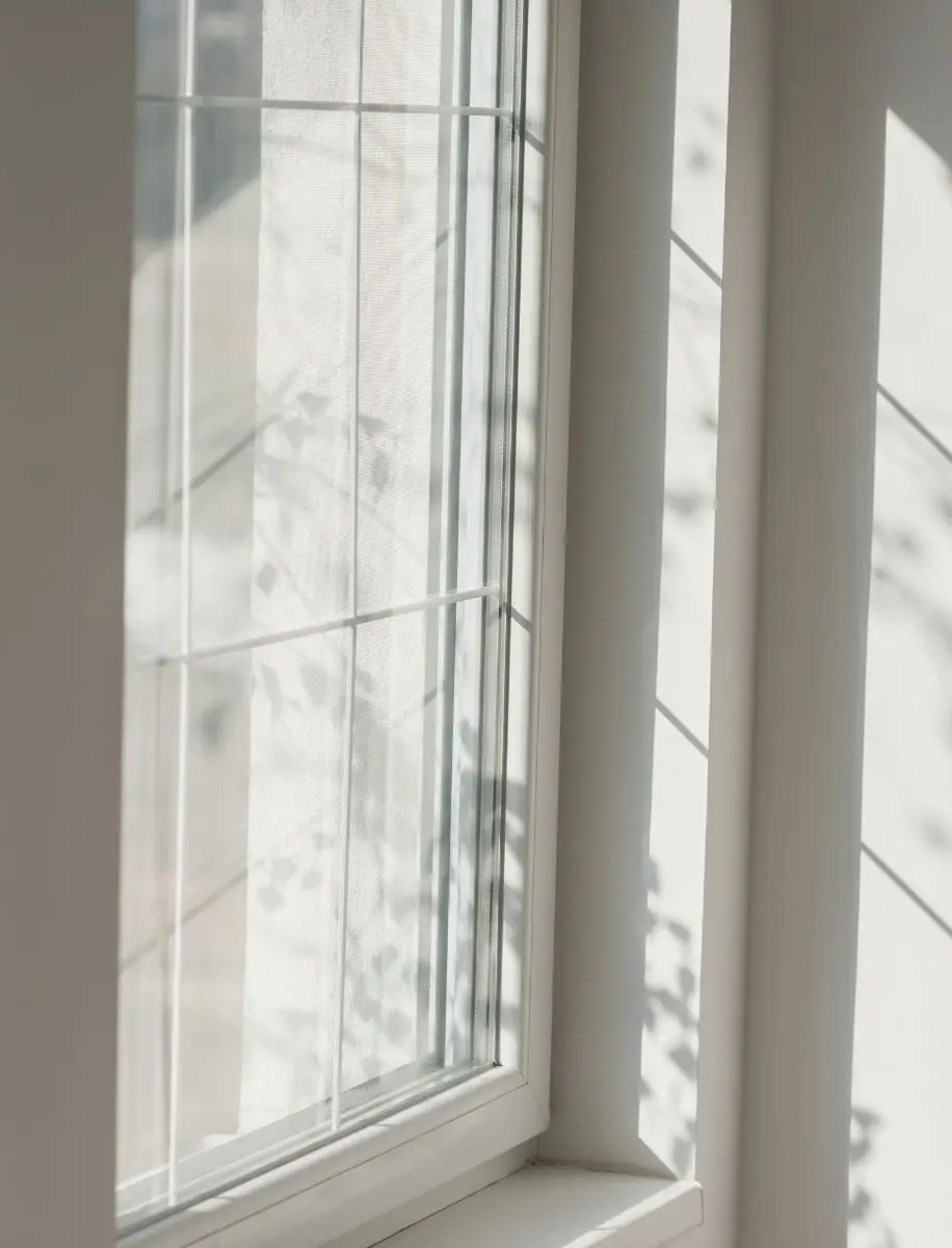 Sunlight Casting Shadows Through Window Glass