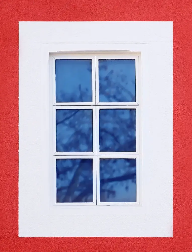 White Grid Window On Red Exterior Wall
