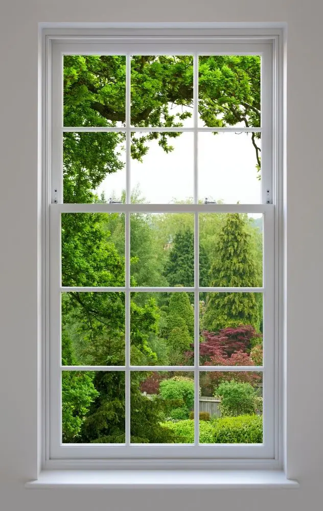 White Grid Window With Green Garden View