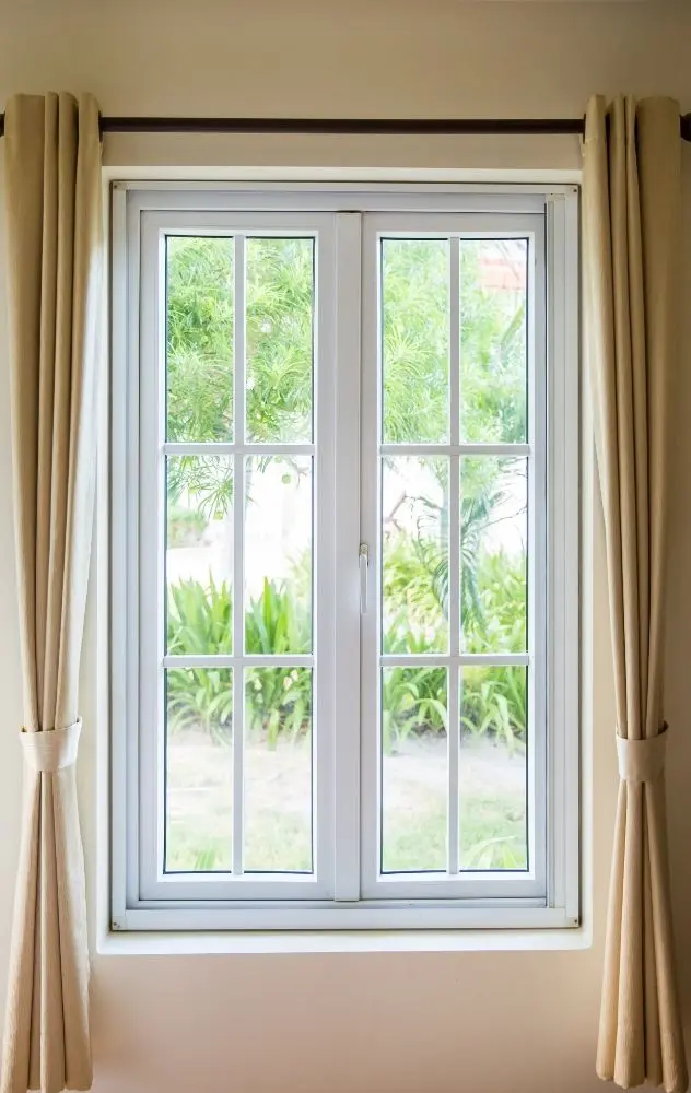 White Window With Curtains And Garden View