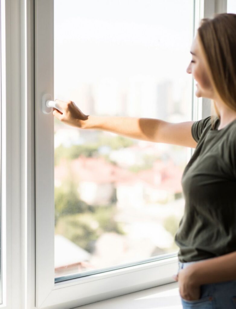 Woman Opening Hurricane Resistant Window